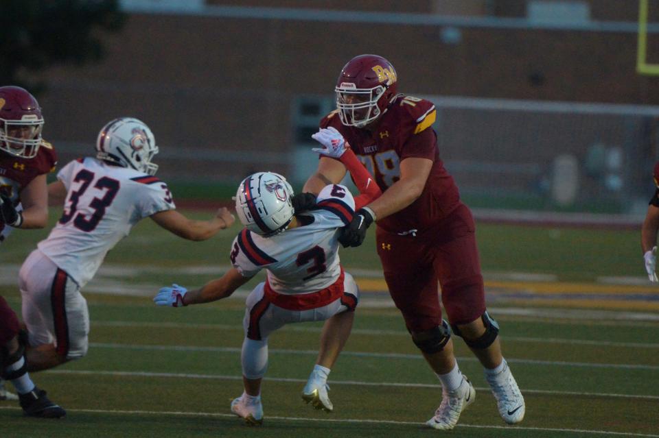 Rocky Mountain football player Ethan Thomason blocks a defender during a game against Chaparral at French Field on Aug. 26. Rocky Mountain won 20-0.