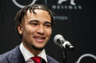 Ohio State quarterback C.J. Stroud smiles during a news conference before attending the Heisman Trophy award ceremony, Saturday, Dec. 11, 2021, in New York. (AP Photo/John Minchillo)