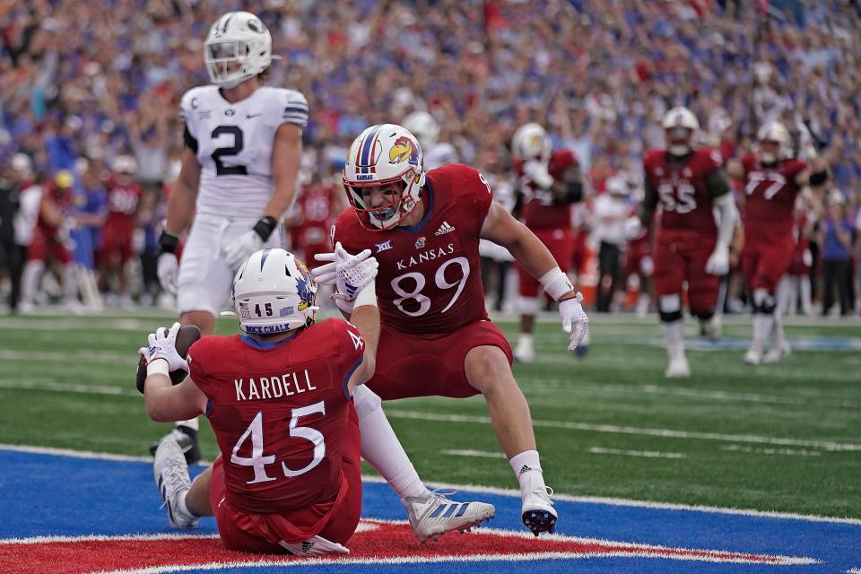 Kansas tight end Trevor Kardell (45) celebrates with teammate and tight end Mason Fairchild (89) after scoring a touchdown during the first half of a game Saturday against BYU in Lawrence.