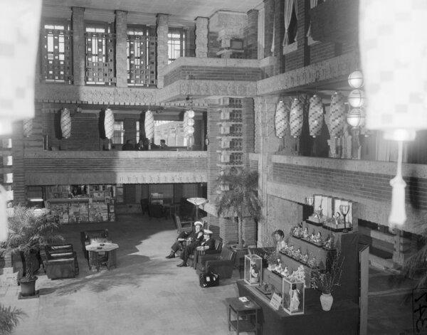 A string of oya blocks rise above the seated patrons in the lobby of the hotel.