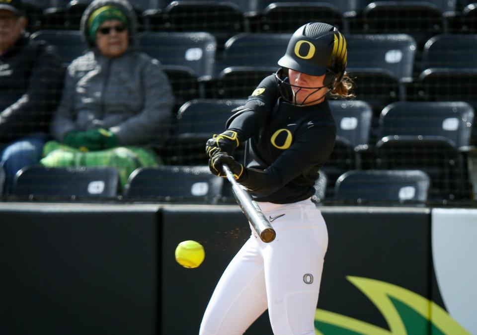 Oregon outfielder Hanna Delgado hits a single as the Oregon Ducks fell to UCLA 7-4 on March 25, 2023, at Jane Sanders Stadium in Eugene.