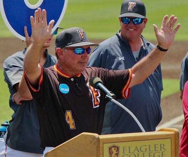 Flagler College baseball coach Dave Barnett acknowledges the crowd before Sunday's game at Drysdale Field as he was honored for winning his 1,000th career game.