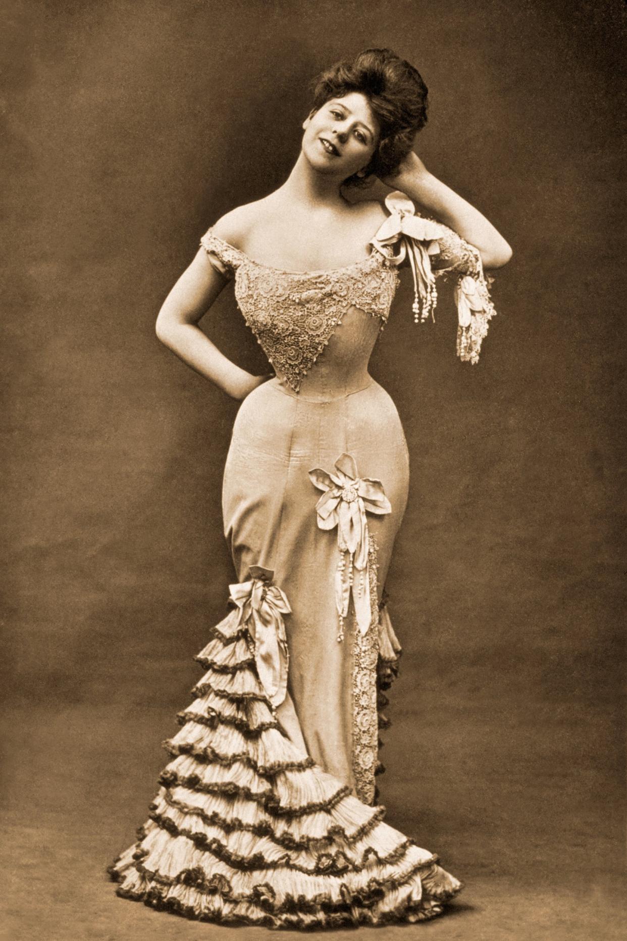 1918 vintage photo of a woman wearing a corset dress