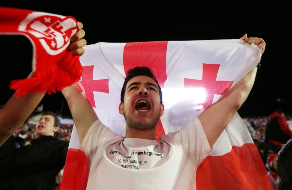 Celebrations back home: Georgia fans go wild in the capital Tbilisi after a historic result (REUTERS)