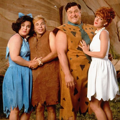 <p>Amblin/Universal/Kobal/Shutterstock</p> Rick Moranis in 1994's 'The Flintstones' with Rosie O'Donnell, John Goodman and Elizabeth Perkins.