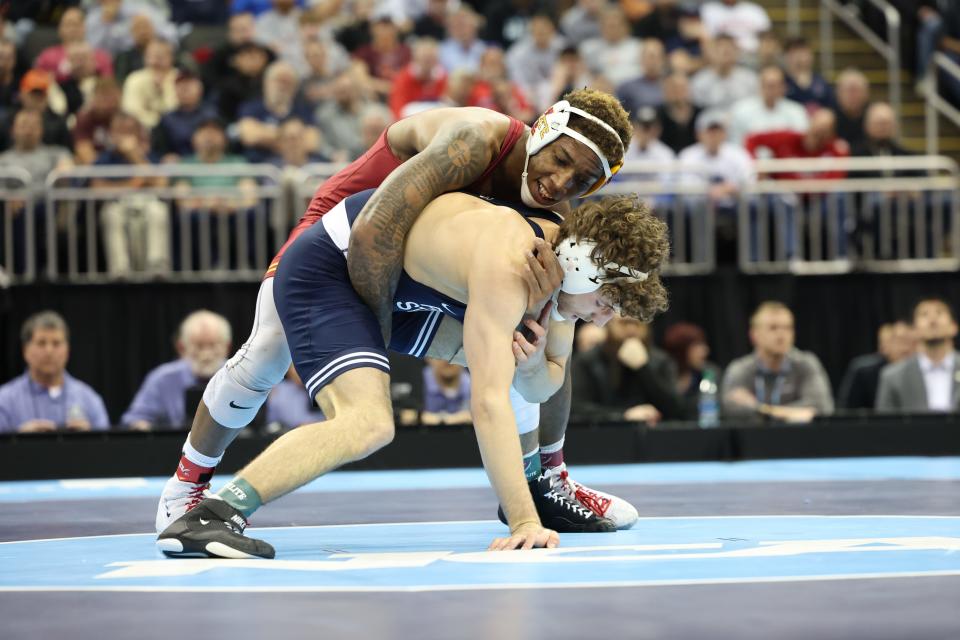 Iowa State's David Carr, a former Perry standout, wrestles Penn State's Mitchell Mesenbrink in the 165-pound final Saturday at the NCAA Division I Wrestling Championships in Kansas City, Mo.