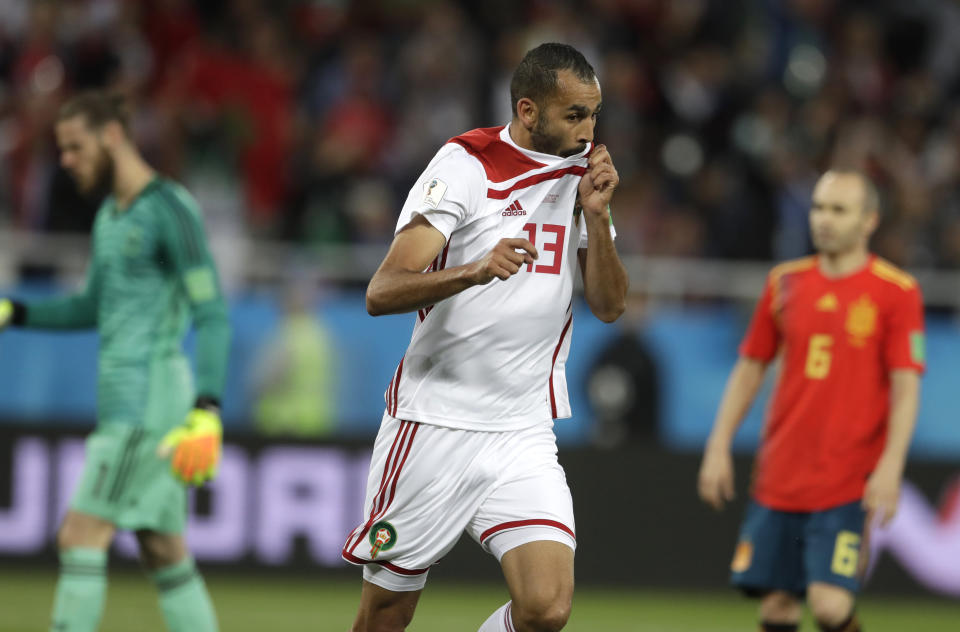 <p>Morocco’s Khalid Boutaib celebrates after his early effort stuns the Spanish </p>