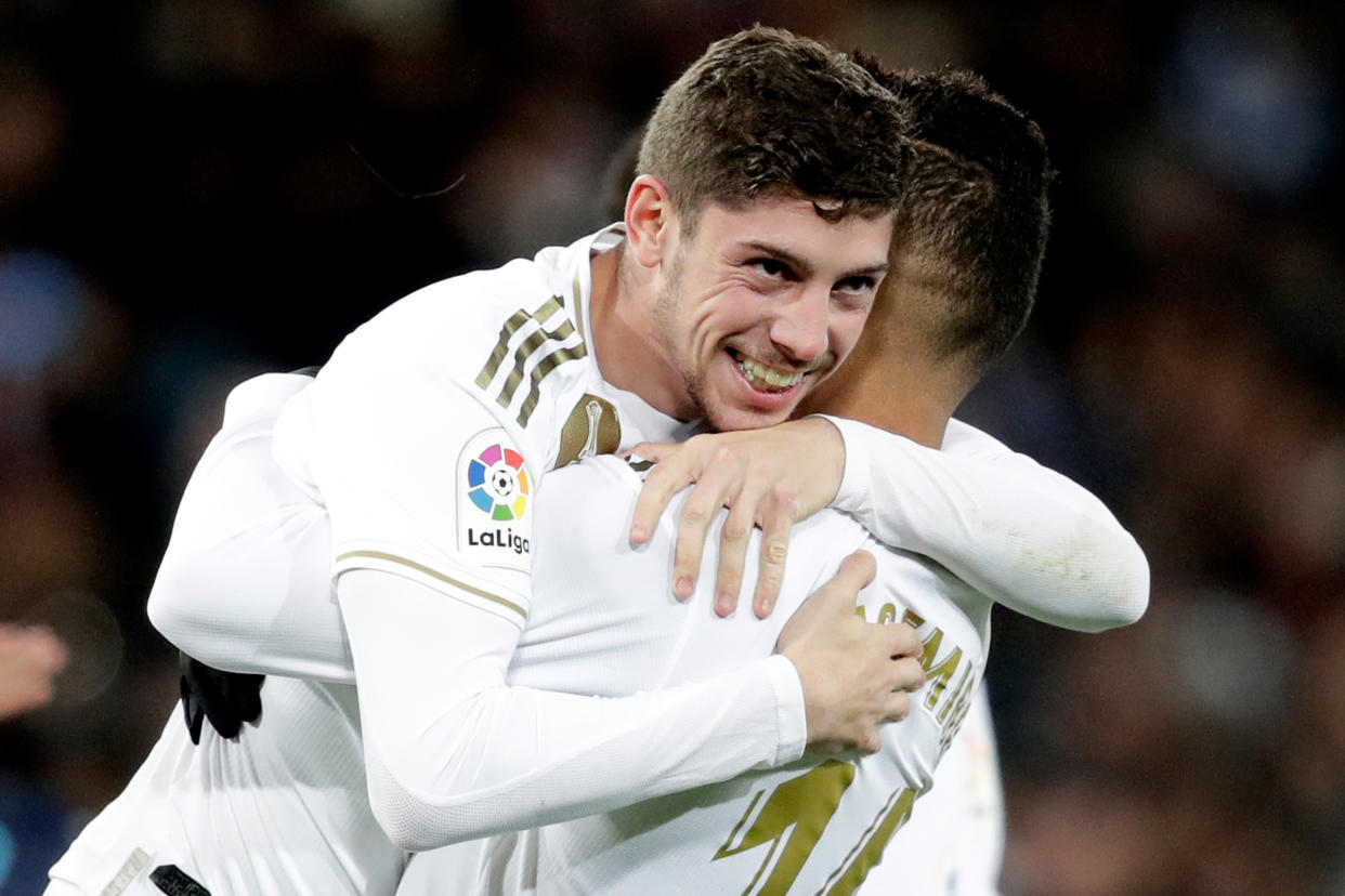 MADRID, SPAIN - NOVEMBER 23: Federico Valverde of Real Madrid celebrates 2-1 with Casemiro of Real Madrid  during the La Liga Santander  match between Real Madrid v Real Sociedad at the Santiago Bernabeu on November 23, 2019 in Madrid Spain (Photo by David S. Bustamante/Soccrates/Getty Images)