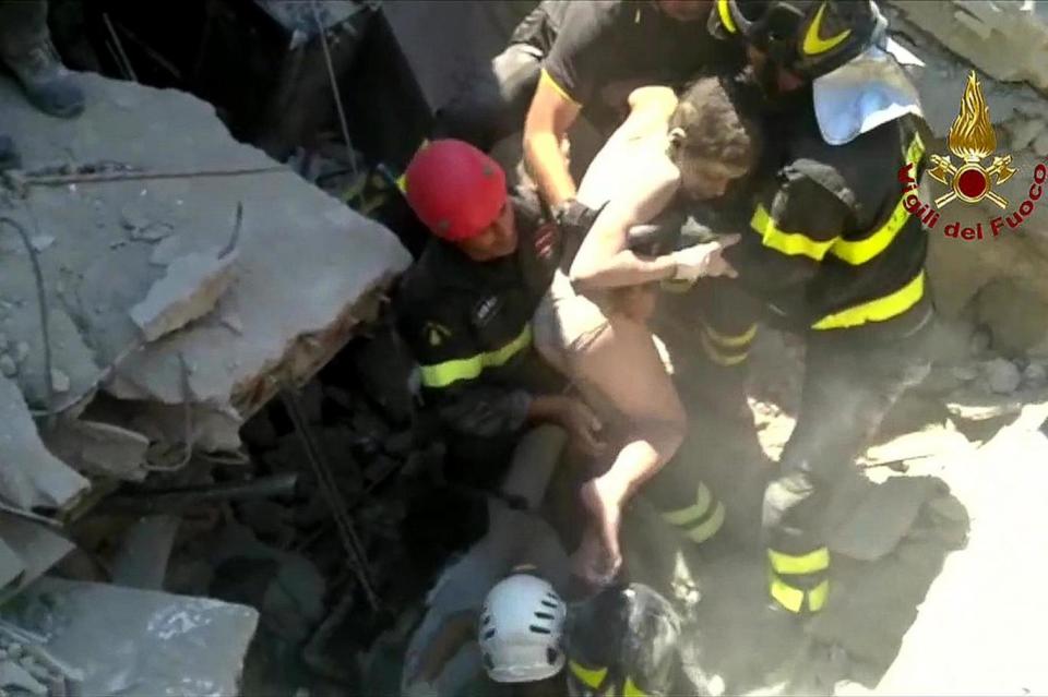 Ciro being evacuated by search and rescue workers. (AFP/Getty Images)