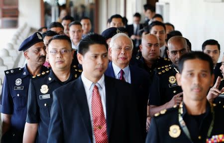 Former Malaysian prime minister Najib Razak (C) arrives in court in Kuala Lumpur, Malaysia July 4, 2018. REUTERS/Lai Seng Sin