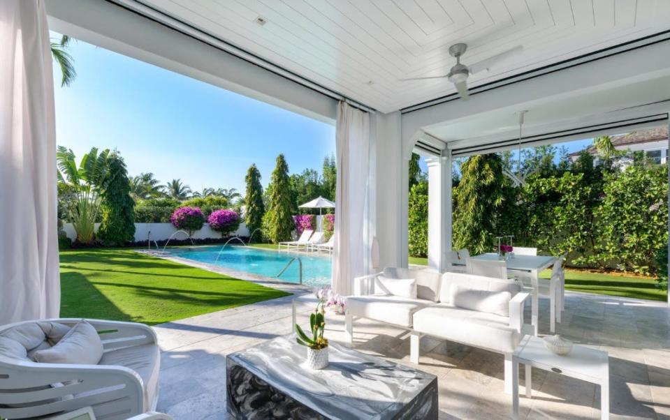 The infinity-edge, 40-foot pool at 596 N. County Road in Palm Beach runs lengthwise away from the house, allowing room for an adjacent lawn area.