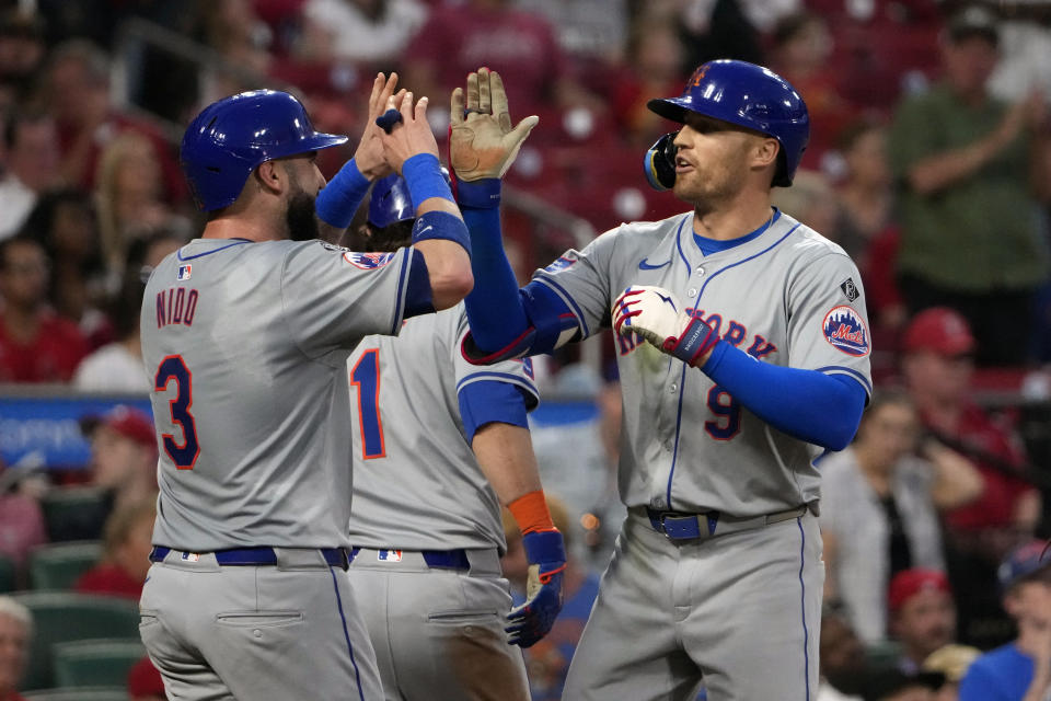 New York Mets' Brandon Nimmo (9) is congratulated by teammate Tomas Nido (3) after hitting a three-run home run during the fifth inning of a baseball game against the St. Louis Cardinals Tuesday, May 7, 2024, in St. Louis. (AP Photo/Jeff Roberson)