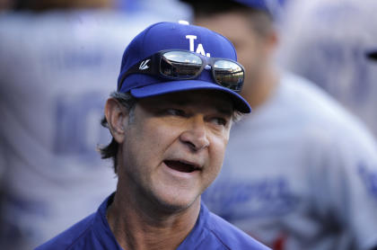 Dodgers manager Don Mattingly is under contract through 2016. (AP)