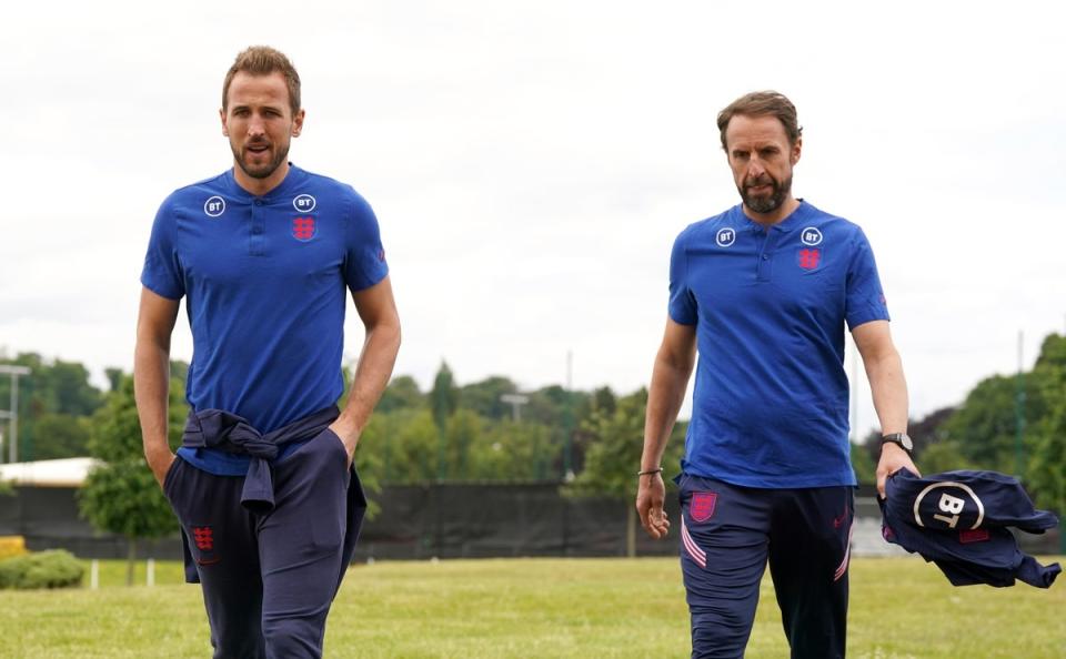 Harry Kane, left, walks with manager Gareth Southgate before a press conference (Nick Potts/PA) (PA Wire)