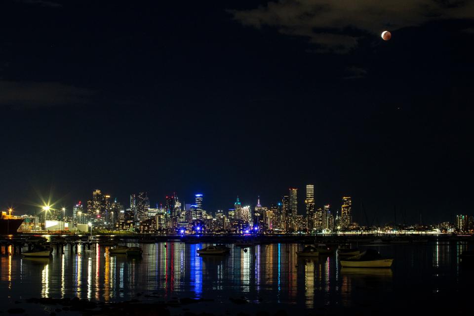 The 'Blood Moon' or lunar eclipse is seen from Williamstown in Melbourne on Nov. 8, 2022 in Melbourne, Australia.