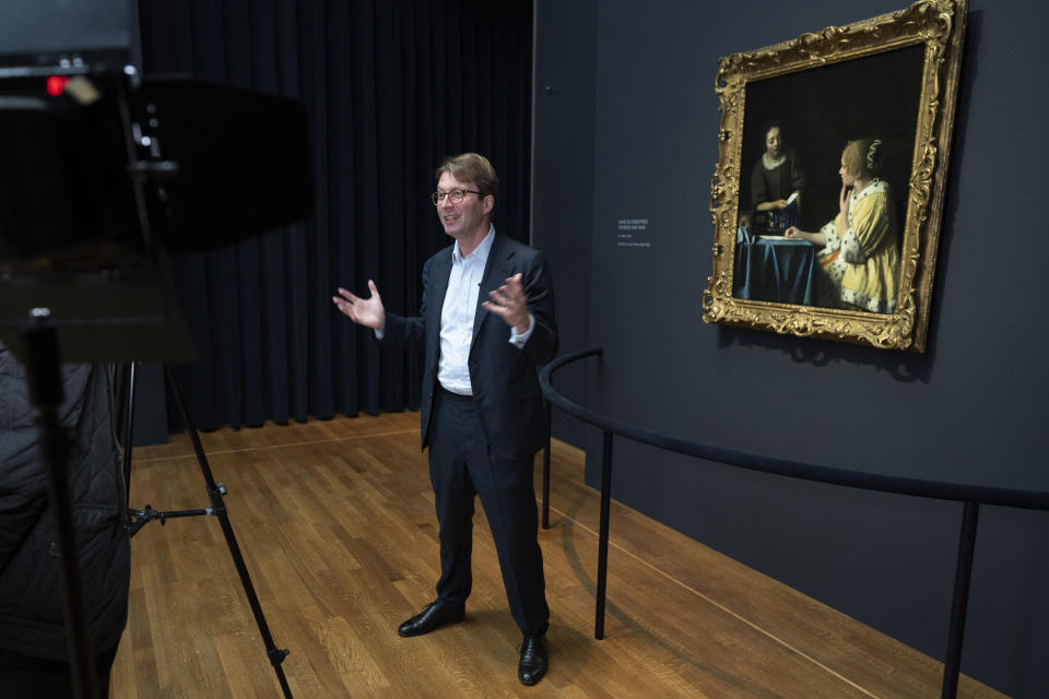 Director Taco Dibbits talks in front of Misstress and Maid, on loan from the Frick Collection, New York, during a press preview of the Vermeer exhibit at Amsterdam's Rijksmuseum, Monday, Feb. 6, 2023, which unveils its blockbuster exhibition of 28 paintings by 17th-century Dutch master Johannes Vermeer drawn from galleries around the world. (AP Photo/Peter Dejong)