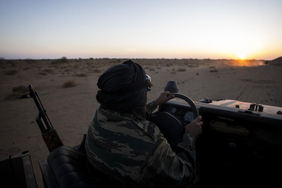 A Polisario Front soldier drives a pickup, near Mehaires, Western Sahara, Thursday, Oct. 14, 2021. For nearly 30 years, the vast territory of Western Sahara in the North African desert has existed in limbo, awaiting a referendum that was supposed to let the local Sahrawi people decide their future. On one side, the Polisario Front wants the territory to be independent, while Morocco claims the area for itself. (AP Photo/Bernat Armangue)