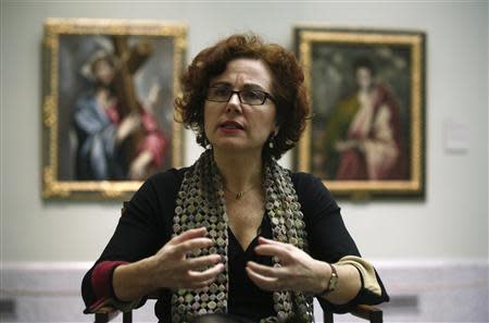 Leticia Ruiz, head of the Prado museum's pre-1700 Spanish painting department, gestures during an interview in the El Greco room at the museum in Madrid, February 5, 2014. REUTERS/Andrea Comas