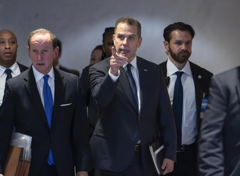 Hunter Biden, son of President Joe Biden, with attorney Abbe Lowell, left, leaves after a closed-door deposition in the Republican-led investigation into the Biden family, on Capitol Hill in Washington, Wednesday, Feb. 28, 2024. (AP Photo/J. Scott Applewhite)