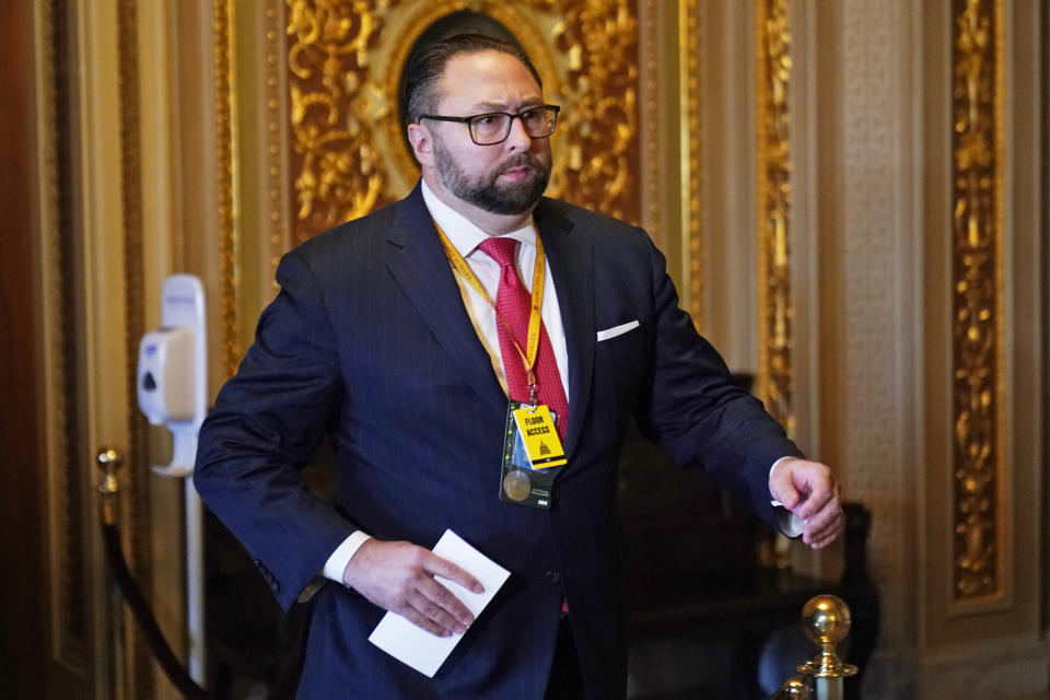 Jason Miller, senior adviser to the Trump 2020 re-election campaign, walks in the Capitol during the second impeachment trial of former President Donald Trump in the Senate on Feb. 9, 2021.  (Andrew Harnik / Pool via AP)