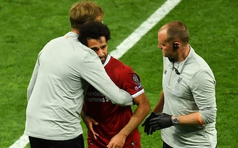 Jurgen Klopp hugs a distressed Mo Salah - Credit: Mike Hewitt/Getty Images