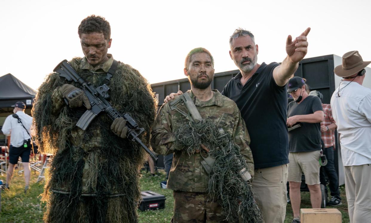 <span>‘You can see polarisation everywhere’ … director Alex Garland (third from left) on the set of his film Civil War.</span><span>Photograph: Murray Close/A24</span>