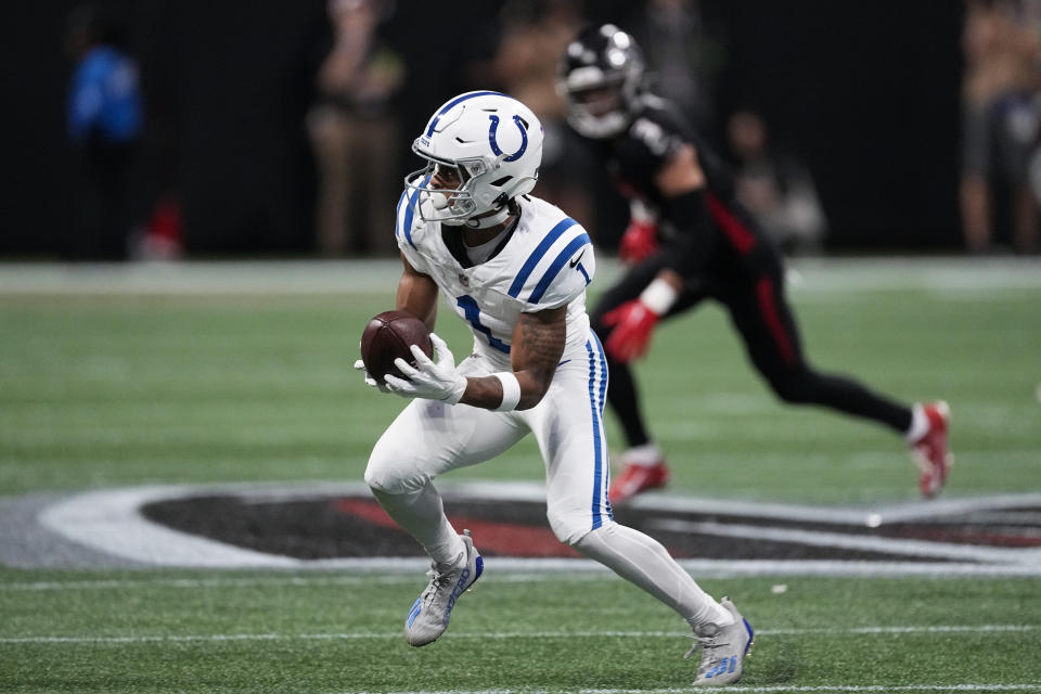 Indianapolis Colts wide receiver Josh Downs (1) makes the catch against the Atlanta Falcons during the first half of an NFL football game, Sunday, Dec. 24, 2023, in Atlanta. (AP Photo/John Bazemore)
