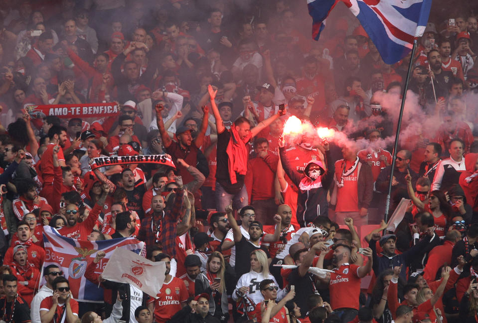 Benfica supporters celebrate their third goal during a Portuguese league last round soccer match between Benfica and Santa Clara at the Luz stadium in Lisbon, Saturday, May 18, 2019. (AP Photo/Armando Franca)