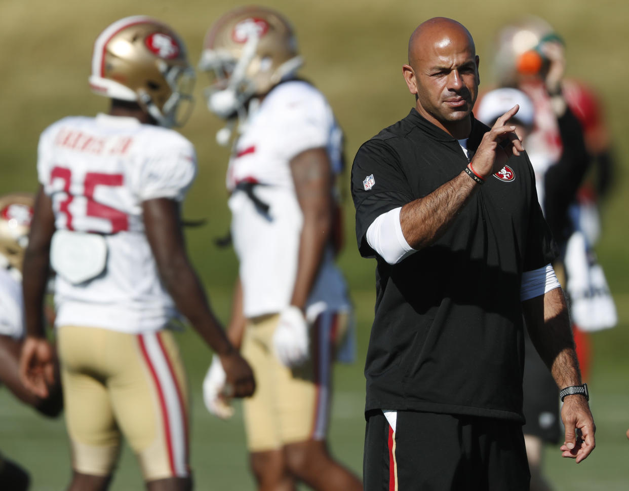 San Francisco 49ers defensive coordinator Robert Saleh directs players during a combined NFL training camp with the Denver Broncos Saturday, Aug. 17, 2019, at the Broncos' headquarters in Englewood, Colo. (AP Photo/David Zalubowski)