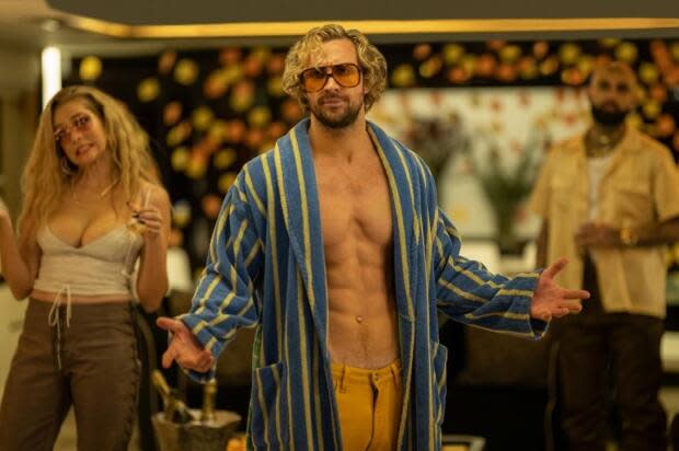 With abs aplenty Aaron Taylor-Johnson plays Tom Ryder, the egomanical movie star Gosling's character is hired to double. 