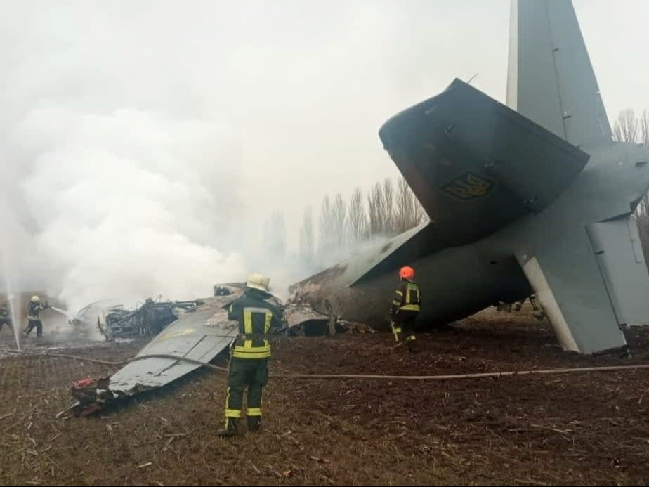 Rescuers work at the crash site of the Ukrainian Armed Forces’ Antonov aircraft, which, according to the state emergency service, was shot down in Kyiv region (via REUTERS)