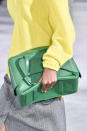 <p>A model carries a boxy green bag from the Tibi FW18 show. (Photo: Getty Images) </p>