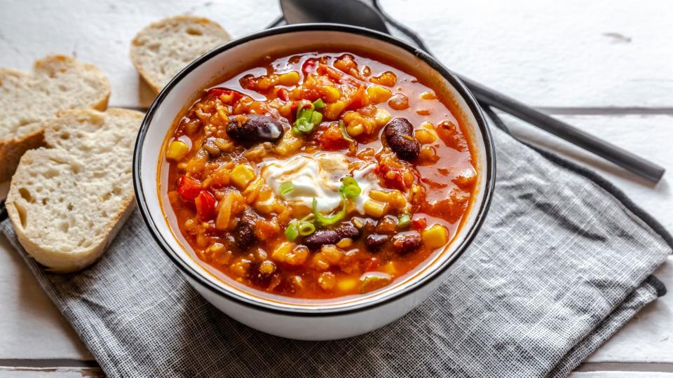 Bowl of vegetarian soup with sourdough bread