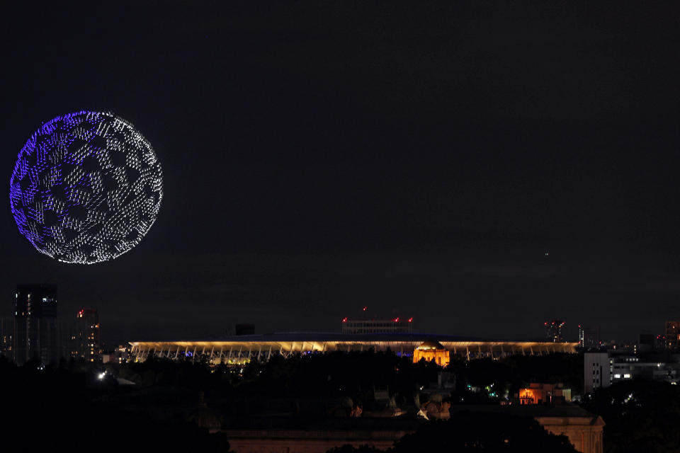 TOKYO, JAPAN - JULY 23: A drone display is seen over the top of the stadium during the Opening Ceremony of the Tokyo 2020 Olympic Games at Olympic Stadium on July 23, 2021 in Tokyo, Japan. (Photo by Atsushi Tomura/Getty Images)