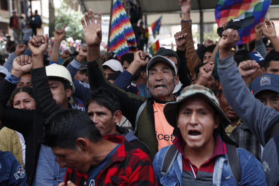 Coca leaf producers chant as they march in support of former President Evo Morales to Cochabamba from Sacaba, Bolivia, Friday, Nov. 15, 2019. Morales has called for the United Nations, and possibly Pope Francis, to mediate in the Andean nation’s political crisis following his ouster as president in what he called a coup d’etat that forced him into exile in Mexico. (AP Photo/Juan Karita)