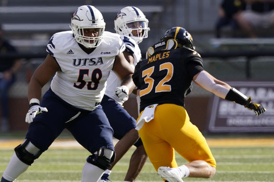 UTSA offensive lineman Terrell Haynes (58) drops back to protect UTSA quarterback Frank Harris, in the background, from Southern Mississippi linebacker Hayes Maples (32) during the first half of an NCAA college football game, Saturday, Nov. 21, 2020, in Hattiesburg, Miss. UTSA won 23-20. (AP Photo/Rogelio V. Solis)