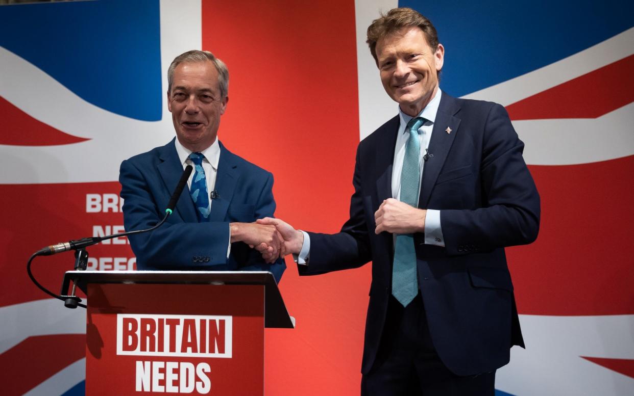 Richard Tice and Nigel Farage shake hands at a Reform UK press conference