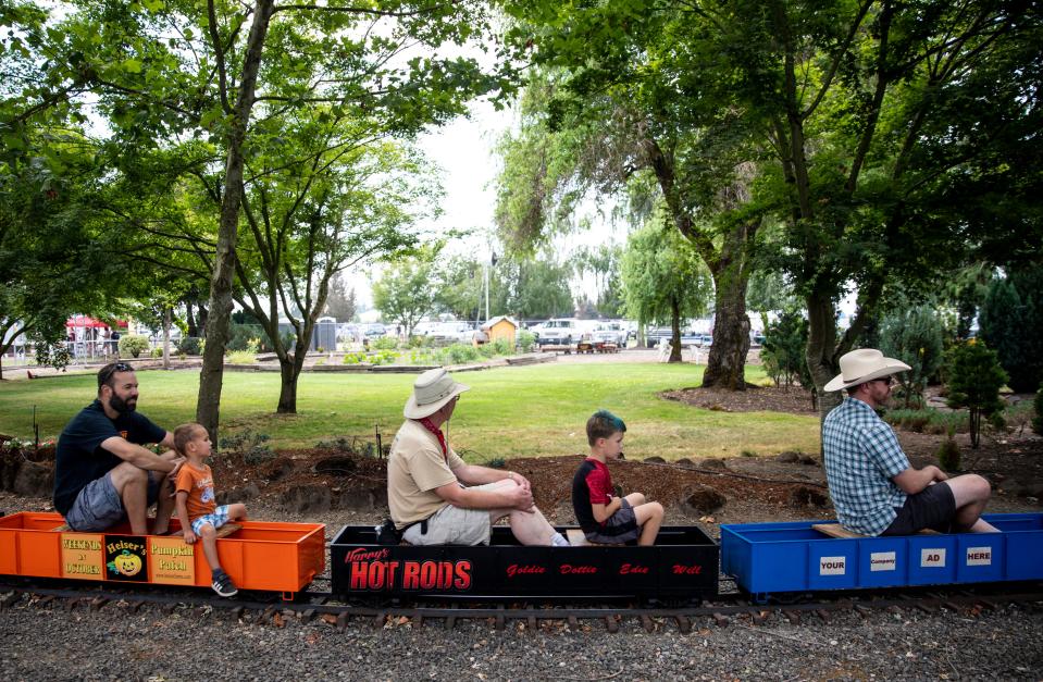 People ride the 1/8 scale train during the Great Oregon Steam-Up at Powerland Heritage Park in Brooks. The event celebrates the machinery of Oregon's past and is held from 7 a.m.-6 p.m. July 29-30 and August 5-6. Admission is $17 for adults and $12 for students. Children 12 and under are free.$17 adults. A $5 parking fee goes to new restrooms on property.