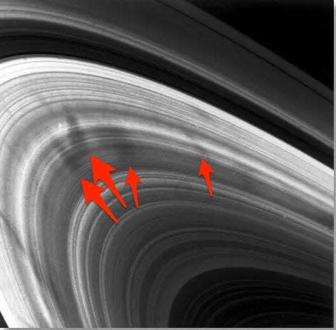 NASA's Voyager 2 image of Saturn's mysterious dark ring spokes.