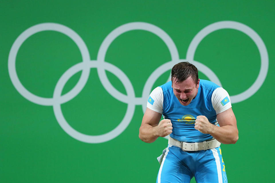 A weightlifter from Kazakhstan reacts during the men's 105kg competition at the Olympics. (Getty)