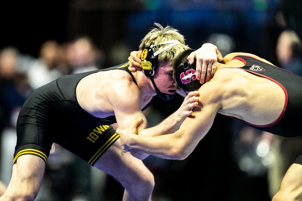 Iowa's Max Murin, left, wrestles Stanford's Jaden Abas at 149 pounds during the second session of the NCAA Division I Wrestling Championships, Thursday, March 16, 2023, at BOK Center in Tulsa, Okla.