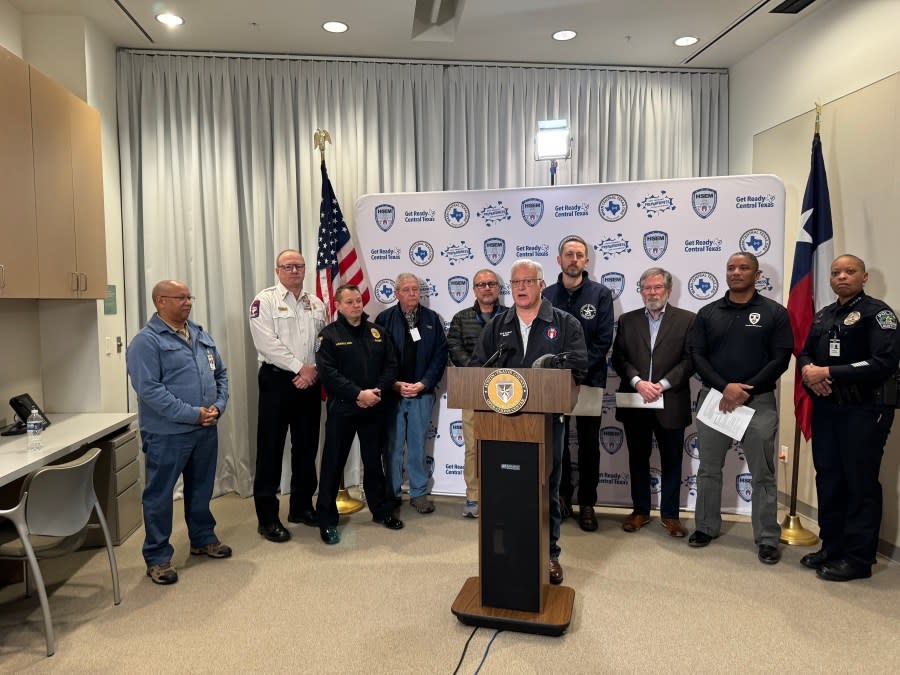 Austin Mayor Kirk Watson leads a news conference on the city’s response to frigid temps. Austin Energy General Manager Bob Kahn (third from left) looks on. (KXAN Photo/Matt Grant)