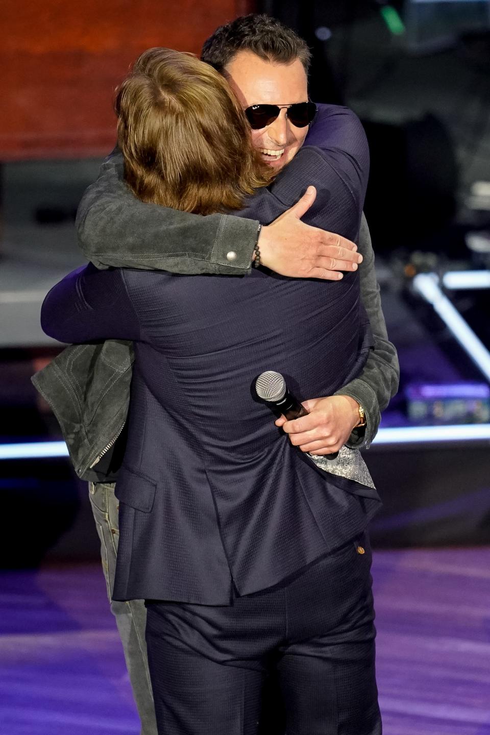 Morgan Wallen, left, accepts the Milestone Award from Eric Church during the 15th Annual Academy Of Country Music Honors at Ryman Auditorium in Nashville, Tenn., Wednesday, Aug. 24, 2022.