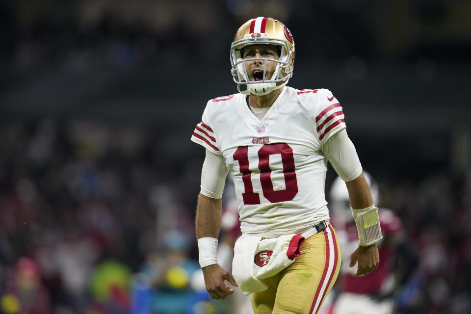 San Francisco 49ers quarterback Jimmy Garoppolo reacts after tight end George Kittle scored a touchdown during the second half of an NFL football game against the Arizona Cardinals, Monday, Nov. 21, 2022, in Mexico City. (AP Photo/Marcio Jose Sanchez)