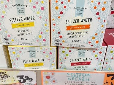 boxes of trader joe's seltzer water on the shelves