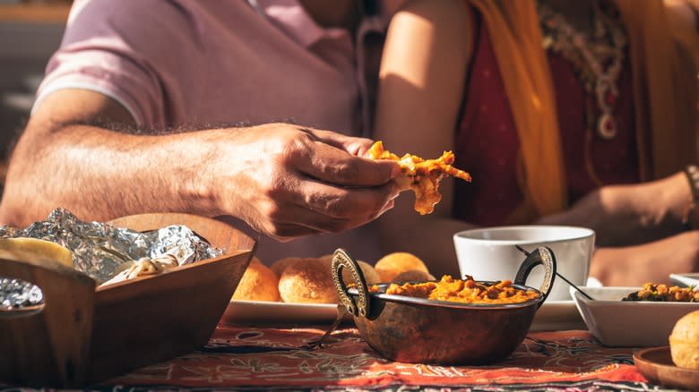 Eating indian food with hands