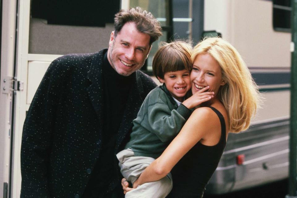 Kelly Preston gets a visit from husband John Travolta (L) and son Jett while on location filming the 1997 motion picture "Addicted to Love.