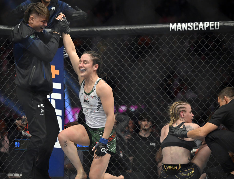 Alexa Grasso, left, is helped up after defeating Valentina Shevchenko in a UFC 285 mixed martial arts flyweight title bout Saturday, March 4, 2023, in Las Vegas. (AP Photo/David Becker)