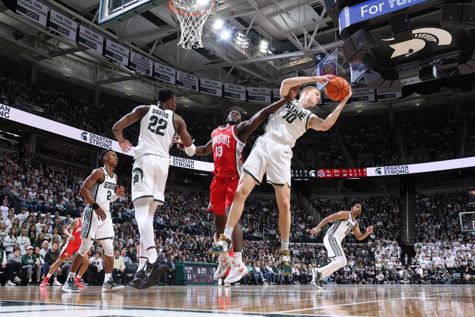 Michigan State forward Joey Hauser grabs a rebound from Ohio State's Isaac Likekele during the second half of MSU's 84-78 win on Saturday, March 4, 2023, at Breslin Center.
