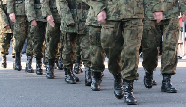 soldiers march in formation